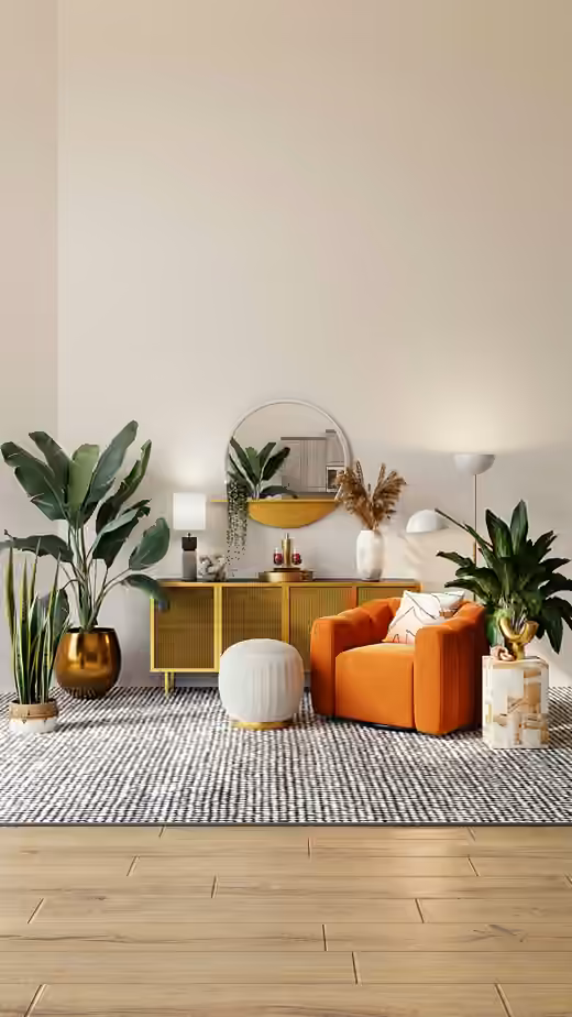 Bright remodeled living room with an orange armchair, gold sideboard and plants