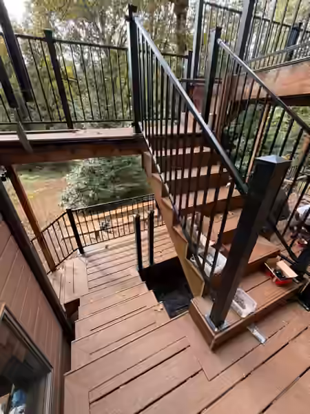 Finished stairs with black steel railings