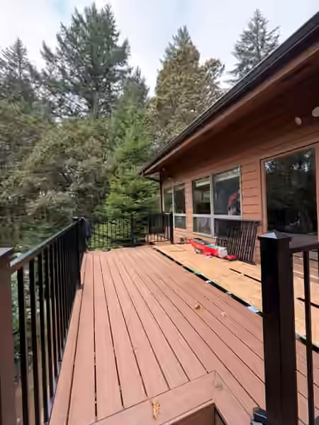 Finished composite deck with black steel railing